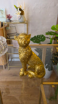 Figur, guld siddende